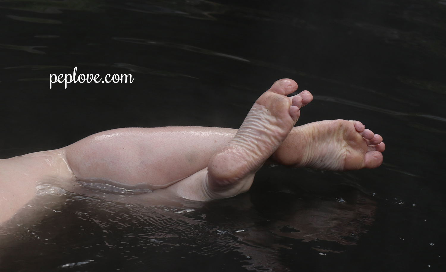 Vivian Crossed Feet Water